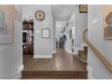 Inviting entryway featuring wooden floors, stairs, and tasteful decor creating a warm welcome at 2111 River City Dr, Laughlin, NV 89029