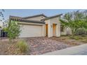 Attractive single-story home featuring desert landscaping and a two-car garage at 26 Sun Mirage Ave, Henderson, NV 89011