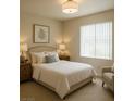 Inviting bedroom featuring a comfortable bed, soft lighting, and a neutral color palette at 2606 S Durango Dr # 277, Las Vegas, NV 89117
