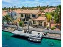 Stunning waterfront home with a private dock and boat, offering serene views and outdoor living at 2708 Port Of Call Dr, Las Vegas, NV 89128