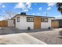 Charming single-story home with a neutral color scheme and well-kept front yard at 2724 Spear St, North Las Vegas, NV 89030