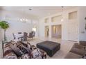 Spacious living room featuring high ceilings, tile flooring, and an open floor plan, ideal for gatherings at 2740 Billy Casper Dr, Las Vegas, NV 89134