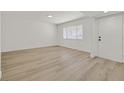 Spacious living room with light flooring and a window providing natural light at 3124 Glenhurst Dr, Las Vegas, NV 89121
