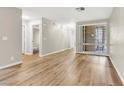 Open-concept living room with light wood flooring and natural light from the window at 3676 Renovah St # 102, Las Vegas, NV 89129