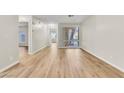 Bright living room featuring modern flooring and large window at 3676 Renovah St # 102, Las Vegas, NV 89129