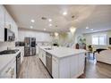 Bright, spacious kitchen with a large island, stainless steel appliances, and pendant lighting at 3846 W Neal Ave, Las Vegas, NV 89141