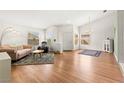 Bright living room with hardwood floors and large windows that bring in natural light at 5224 Dana Springs Way, Las Vegas, NV 89130