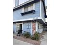 Charming two-story exterior with blue siding, brick accents and a well-maintained front yard at 5365 Shake Ct # 103, Las Vegas, NV 89122