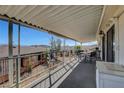 Relaxing covered patio featuring beautiful mountain views and outdoor seating area at 621 Mount Elbert Way, Boulder City, NV 89005
