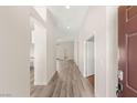 Inviting entryway with hardwood floors, leading to open floor plan and rooms with natural light at 6512 N Bruce St, North Las Vegas, NV 89086