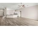 Open-concept living room with recessed lighting and wood-look flooring at 6512 N Bruce St, North Las Vegas, NV 89086