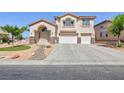 Two-story home with three-car garage, desert landscaping, and stone accents on the columns at 6638 Dazzling Heights Ln, Las Vegas, NV 89110