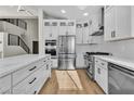 Bright kitchen with white cabinets, stainless steel appliances, and a modern design at 8125 Sunset Cove Dr, Las Vegas, NV 89128