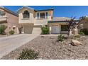 Charming two-story home featuring a tile roof, attached two-car garage, and desert rock landscaping at 9044 Crimson Clover Way, Las Vegas, NV 89134