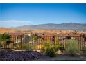 Scenic view from the property showcasing rooftops and mountain landscapes against a clear sky at 1130 Calico Rdg, Mesquite, NV 89034