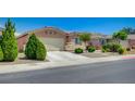 Attractive single-story home featuring a two-car garage, low-maintenance landscaping and a concrete driveway at 7822 Whitlocks Mill Ave, Las Vegas, NV 89147