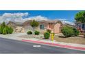 Inviting single-story home with a two-car garage, xeriscaping, a yellow fire hydrant and concrete walkway at 7822 Whitlocks Mill Ave, Las Vegas, NV 89147