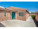 This backyard features a large patio, low block wall and neutral desert landscaping at 7822 Whitlocks Mill Ave, Las Vegas, NV 89147