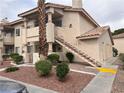 Two-story exterior of home with low maintenance landscaping at 921 Sulphur Springs Ln # 201, Las Vegas, NV 89128