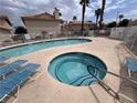 Inviting community pool and hot tub, perfect for relaxing and enjoying the outdoors at 921 Sulphur Springs Ln # 201, Las Vegas, NV 89128