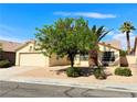Single-Gathering home with a low-maintenance front yard and mature shade trees at 3523 Calf Roper Ct, North Las Vegas, NV 89032