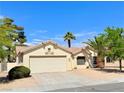 Charming single-story home with a xeriscaped front yard and tile roof at 3523 Calf Roper Ct, North Las Vegas, NV 89032