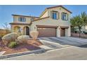 Inviting two-story home with manicured landscaping, terracotta roof tiles and attached two car garage at 10611 Auburn Springs Ave, Las Vegas, NV 89166