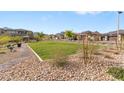 Scenic view of community park, featuring well-maintained green space and walking paths at 127 Medianoche St, Las Vegas, NV 89138