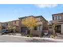Attractive two-story home showcasing a gray exterior, two-car garage, and manicured landscaping at 127 Medianoche St, Las Vegas, NV 89138