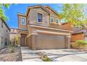 Charming two-story home featuring desert landscaping and an attached two-car garage at 137 Desert Pond Ave, Henderson, NV 89002