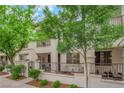 Townhouse exterior featuring a gated courtyard with seating at 1525 Spiced Wine Ave # 10102, Henderson, NV 89074