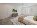 Bright bedroom with a neutral color scheme, large windows, and a comfortable bed at 19 Desert Ivy Ln, Henderson, NV 89011