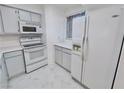 Kitchen featuring white appliances, white cabinets, and white countertops for a clean and bright cooking space at 2044 Mesquite Ln # 202, Laughlin, NV 89029