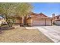 Charming home featuring a terracotta roof, a two-car garage, and desert-friendly landscaping at 266 Cordero Dr, Henderson, NV 89074