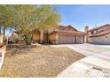 Charming home featuring a terracotta roof, a two-car garage, and desert-friendly landscaping at 266 Cordero Dr, Henderson, NV 89074