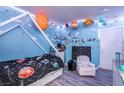 Playful bedroom adorned with planet-themed decorations and a unique bed frame at 3018 Sunrise Bay Ave, North Las Vegas, NV 89031
