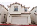 Inviting two-story home with a neutral stucco exterior and attached two-car garage at 3018 Sunrise Bay Ave, North Las Vegas, NV 89031