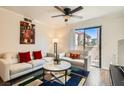 Bright living room with neutral decor, modern furnishings, and sliding glass doors to the outside at 3135 S Mojave Rd # 146, Las Vegas, NV 89121