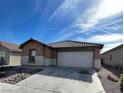Inviting single-story home with a two-car garage and low-maintenance landscaping at 3425 Palatine Hills Ave, North Las Vegas, NV 89081