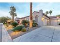 Home with stucco exterior, tile roof, 3-car garage and desert landscaping at 3540 Wisdom Ct, Las Vegas, NV 89120