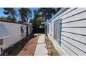 Exterior shot from the side of the home showcasing yard and exterior access door at 3717 Casey Dr, Las Vegas, NV 89120