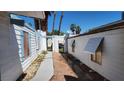 A full shot from the side of the home, showing yard, windows, and exterior access at 3717 Casey Dr, Las Vegas, NV 89120