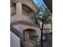 Exterior angle view of condo building with stairs and multiple decks at 5750 E Hacienda Ave # 117, Las Vegas, NV 89122