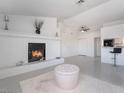 Spacious living area features a modern fireplace, bar seating, and contemporary design at 5841 Medallion Dr # 202, Las Vegas, NV 89122