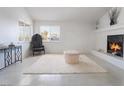 Cozy living room with fireplace, large windows and soft carpet; perfect for relaxation at 5841 Medallion Dr # 202, Las Vegas, NV 89122