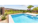 Inviting backyard pool with scenic golf course and mountain views, perfect for relaxation at 59 Reflection Bay Dr, Henderson, NV 89011