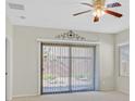Bedroom featuring neutral walls, carpeting, and a sliding glass door at 6064 Isola Peak Ave, Las Vegas, NV 89122