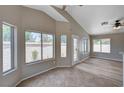 Cozy living area with tile floors and plenty of sunlight from the many windows at 8028 Hurricane Cove Ct, Las Vegas, NV 89129