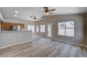 Bright living room with wood floors, lots of windows and ceiling fans at 8028 Hurricane Cove Ct, Las Vegas, NV 89129