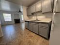 Open-concept kitchen view showcases the kitchen island, updated appliances, and adjacent living area at 9975 Peace Way # 1140, Las Vegas, NV 89147